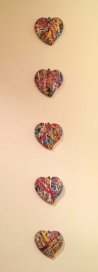 Five of hearts, sculpture by Nicola Guerraz, acrylic on resin, pentaptych, 15 cm each, 1997
