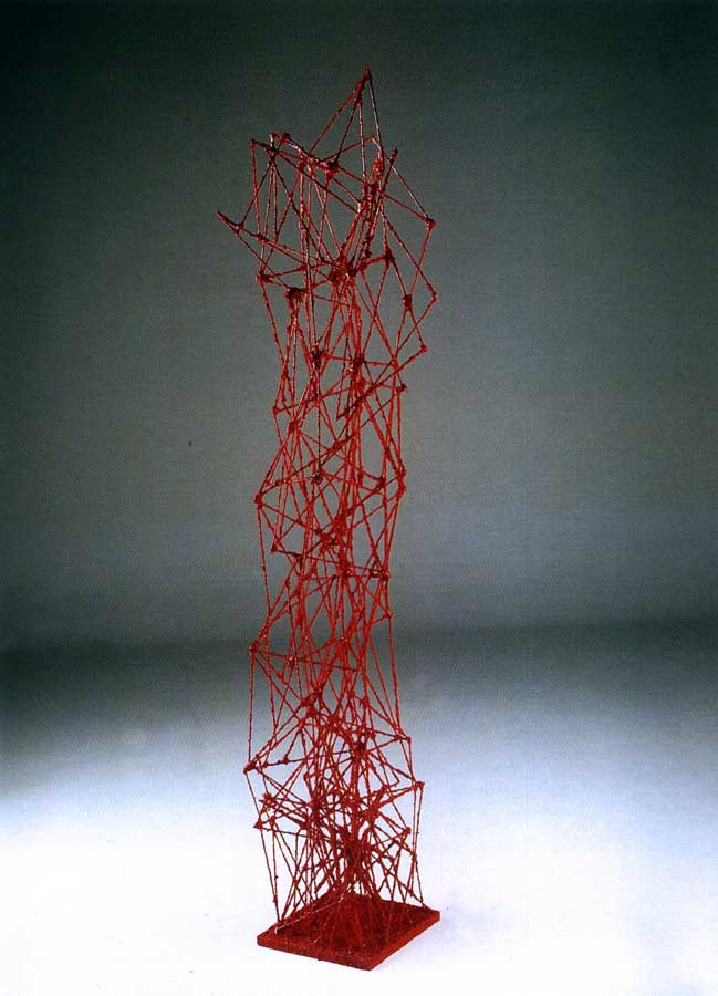 Ragnatela in rosso, sculpture by Nicola Guerraz, acrylic on wood, h 188 cm, 2000