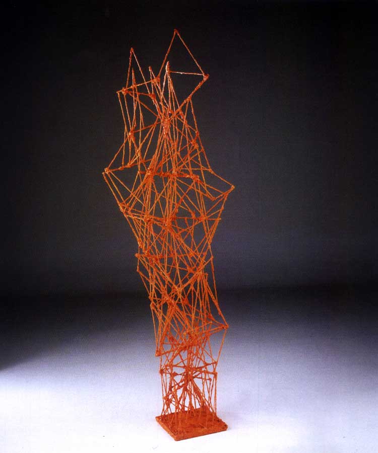 Ragnatela in arancione, sculpture by Nicola Guerraz, acrylic on wood, h 186 cm, 2000