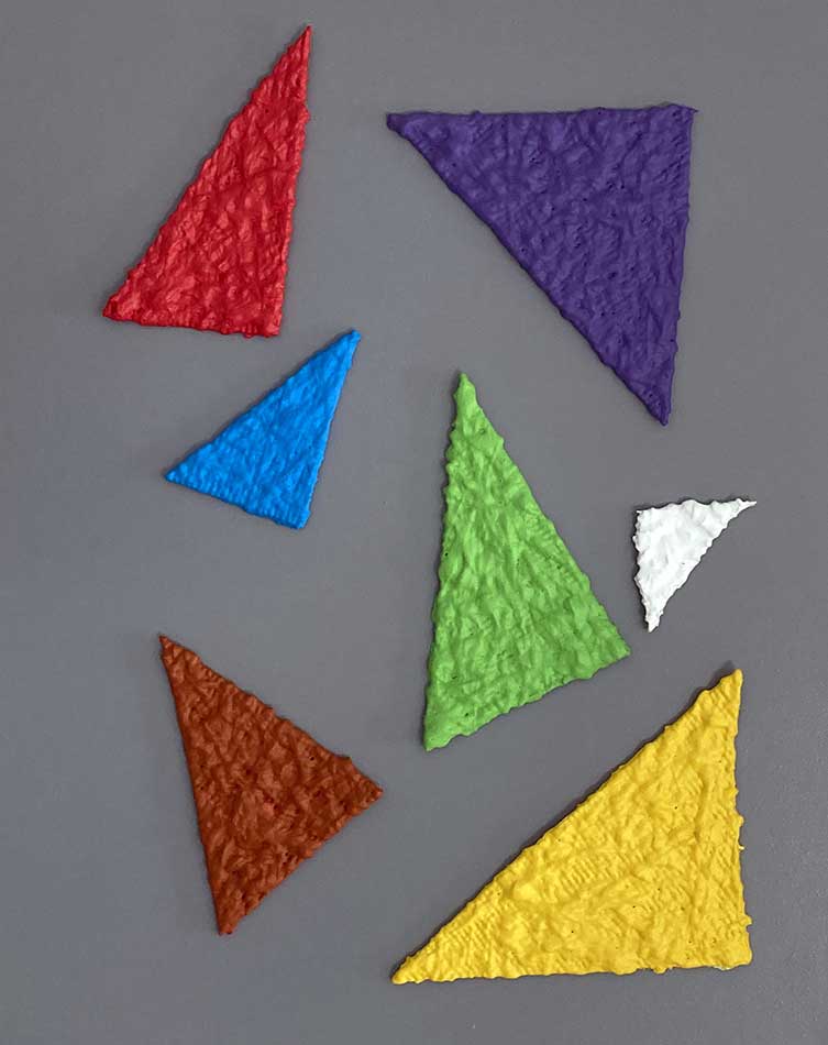 Coloured triangles, painting by Nicola Guerraz, synthetic rubber and acrylic on canvas 40 x 50 cm 2021